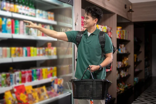 An Asian man delivery choosing goods from online order in supermarket , online delivery service concept