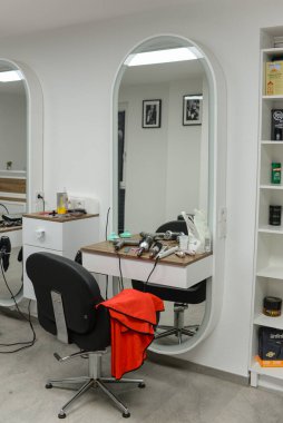 The tools of the hairdresser lie on the table. Workplace in a hairdresser