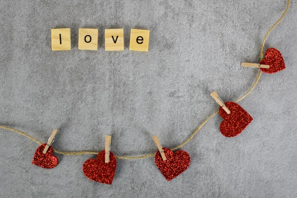 wooden letters I love you with hearts on a string, copy space. Love concept.