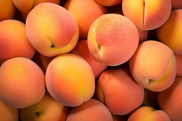 bright delicious juicy peaches, peach background. High quality photo