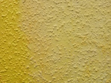 Bu canlı sarı duvar dokusu çarpıcı arka planlar, sanat projeleri ve tasarım elementleri için mükemmeldir.