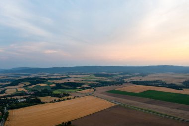 Beautiful golden sunset over wheat field, rural scene, top view