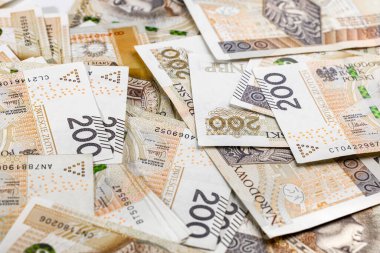 Scattered banknotes of Polish two hundredth bills