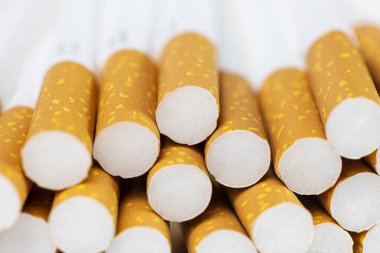 Cigarette filters close-up, smoking tobacco products, harm to health
