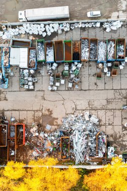 Industrial area of the city from above. Many containers, garbage recycling, metal collection