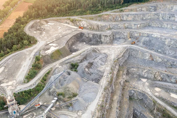 View from a height of an open stone quarry, building stone mining, granite