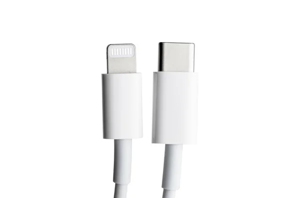 White Type-C cable and lightning, close-up on a white background