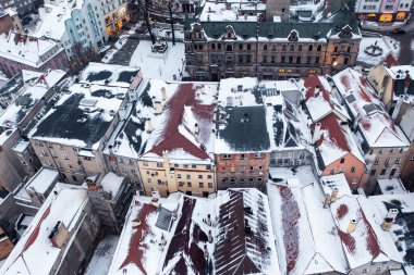 Aerial view of a snowy old German town, aerial view of the snow-covered roofs of houses, winter landscape