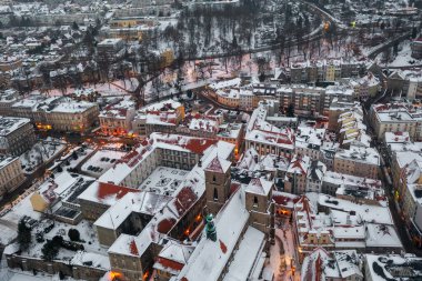 Aerial view of a snowy old German town, aerial view of the snow-covered roofs of houses, winter landscape