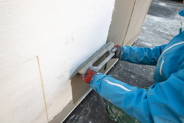 Builder Plastering Wall Spatula Fiberglass Mesh Insulating House Stockbild