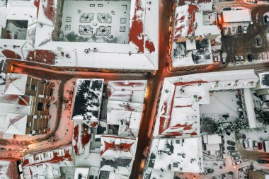Aerial view of a snowy old German town, aerial view of the snow-covered roofs of houses, winter landscape