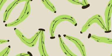 Yeşil muzlar bej yüzey desenlerine saçılmış