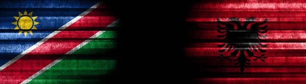 Namibie Albánie Vlajky Černém Pozadí — Stock fotografie