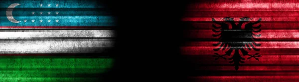 Uzbekistán Albania Banderas Sobre Fondo Negro — Foto de Stock