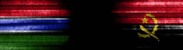 冈比亚和安哥拉黑色背景旗 — 图库照片