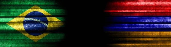 巴西和亚美尼亚关于黑人背景的旗帜 — 图库照片