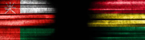 Oman Und Bolivien Flaggen Auf Schwarzem Hintergrund — Stockfoto
