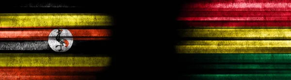 Flaggen Von Uganda Und Bolivien Auf Schwarzem Hintergrund — Stockfoto