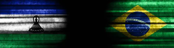 ブラックバックグラウンドのレソトとブラジルの旗 — ストック写真