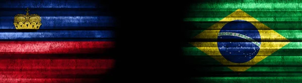 ブラック バックグラウンドのリヒテンシュタインとブラジルの旗 — ストック写真