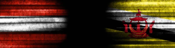 stock image Austria and Brunei Flags on Black Background