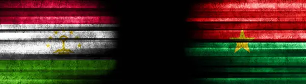 Tajikistan Burkina Faso Flags Black Background — Stock Photo, Image