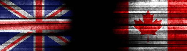 イギリスとカナダの黒い背景の旗 — ストック写真