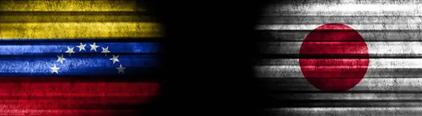 Venezuela and Japan Flags on Black Background