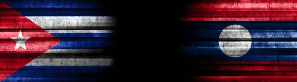 Kuba Und Laos Flaggen Auf Schwarzem Hintergrund — Stockfoto