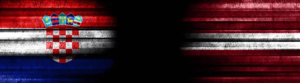 克罗地亚和拉脱维亚黑色背景旗 — 图库照片