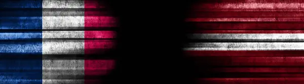 France and Latvia Flags on Black Background