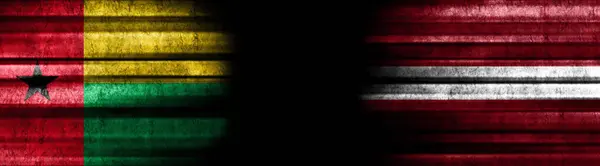 Guinea Bissau Lettonia Bandiere Sfondo Nero — Foto Stock