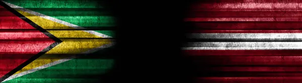 Guyana Lotyšsko Vlajky Černém Pozadí — Stock fotografie