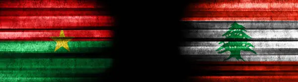 黒い背景のブルキナファソとレバノンの旗 — ストック写真