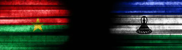 布基纳法索和莱索托黑色背景旗 — 图库照片