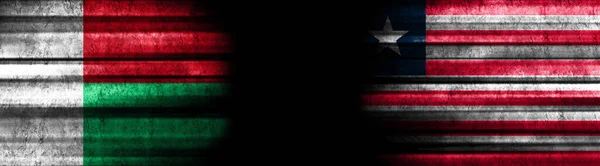 Madagascar Liberia Flags Black Background — Stock Photo, Image