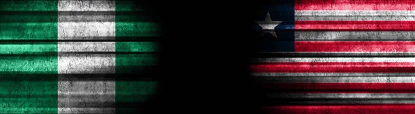 Nigeria Und Liberia Flaggen Auf Schwarzem Hintergrund — Stockfoto