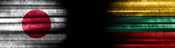 Japan and Lithuania Flags on Black Background