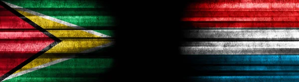 Guyana Och Luxemburgs Flaggor Med Svart Bakgrund — Stockfoto