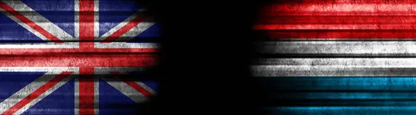 Kara Arkaplanda Birleşik Krallık Lüksemburg Bayrakları — Stok fotoğraf