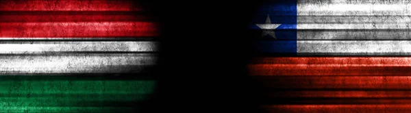 匈牙利和智利关于黑人背景的旗帜 — 图库照片