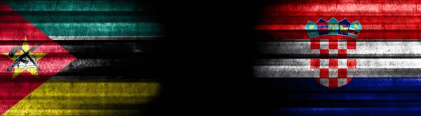 莫桑比克和克罗地亚黑色背景旗 — 图库照片
