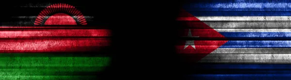 Malawi and Cuba Flags on Black Background