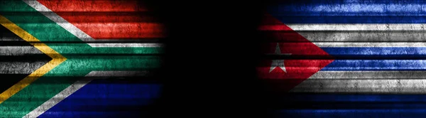 South Africa and Cuba Flags on Black Background