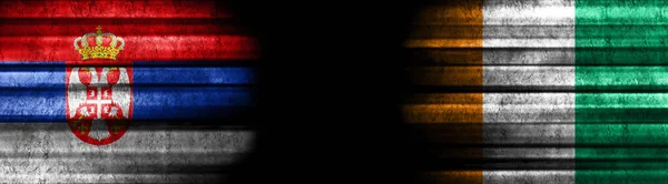 Servië Ivoorkust Vlaggen Zwarte Achtergrond — Stockfoto