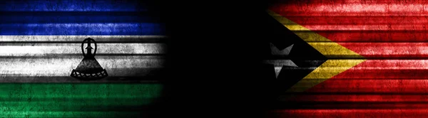 Lesotho Timor Oriental Banderas Sobre Fondo Negro —  Fotos de Stock
