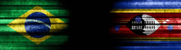 stock image Brazil and Eswatini Flags on Black Background