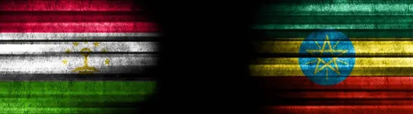 Σημαίες Τατζικιστάν Και Αιθιοπίας Μαύρο Φόντο — Φωτογραφία Αρχείου
