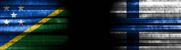 Solomon Islands and Finland Flags on Black Background