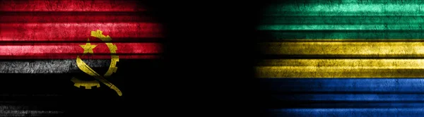 安哥拉和加蓬黑色背景旗 — 图库照片